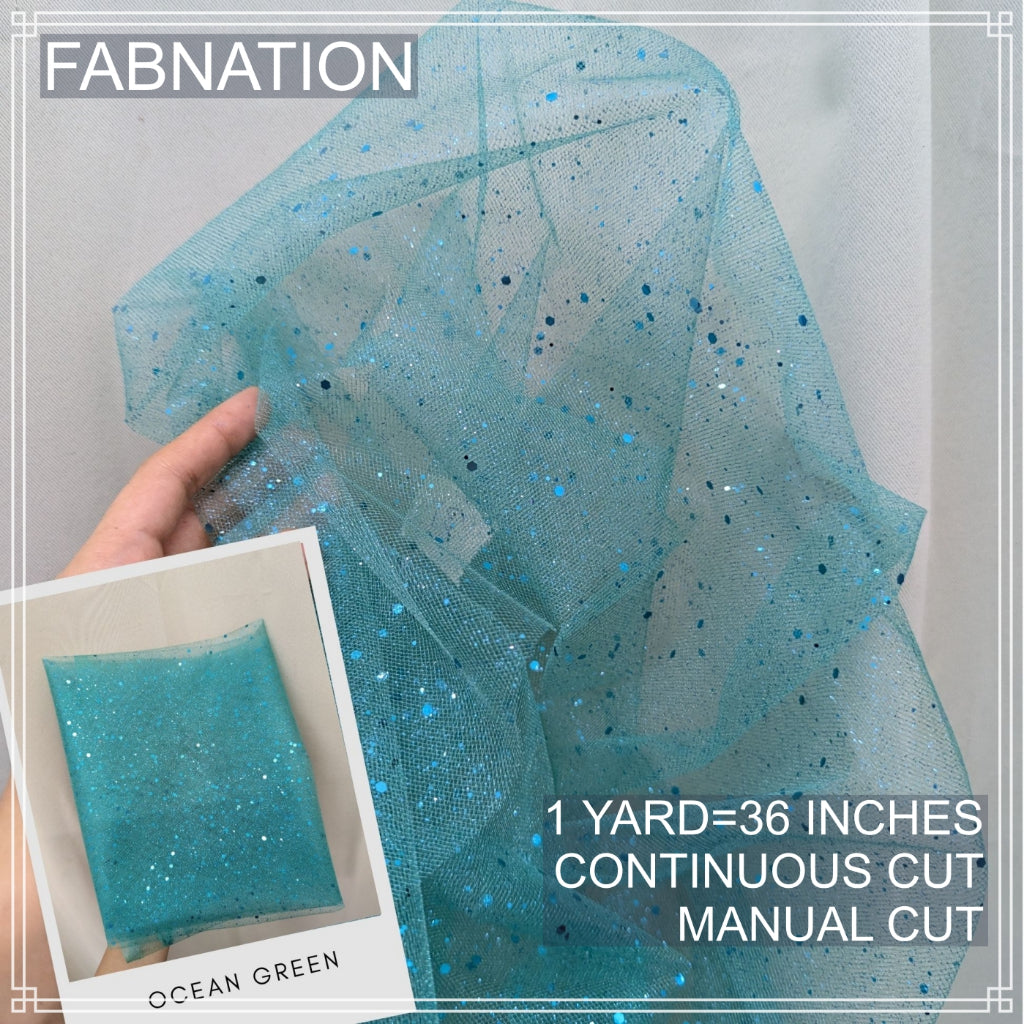 SILENKA GLITTERED TULLE WITH FALLING GLITTERS FABRIC PER YARD IS 36 INCHES LENGTH AND 60 FIXED WIDTH