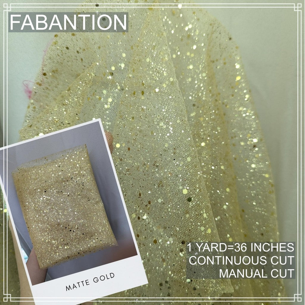 SILENKA GLITTERED TULLE WITH FALLING GLITTERS FABRIC PER YARD IS 36 INCHES LENGTH AND 60 FIXED WIDTH