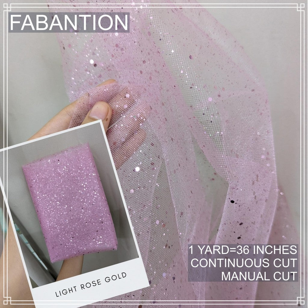 SILENKA GLITTERED TULLE WITH FALLING GLITTERS FABRIC PER YARD IS 36 INCHES LENGTH AND 60 FIXED WIDTH