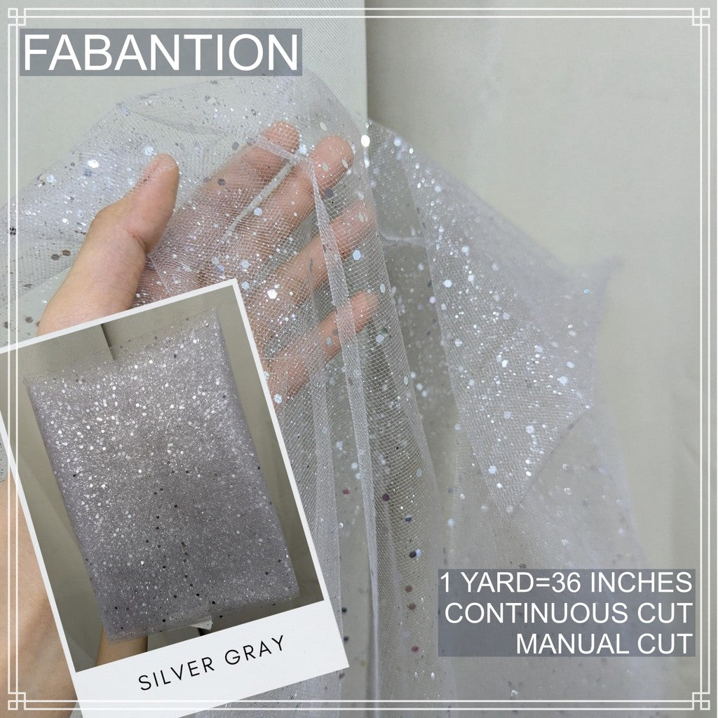 SILENKA GLITTERED TULLE WITH FALLING GLITTERS FABRIC PER YARD IS 36 INCHES LENGTH AND 60 FIXED WIDTH
